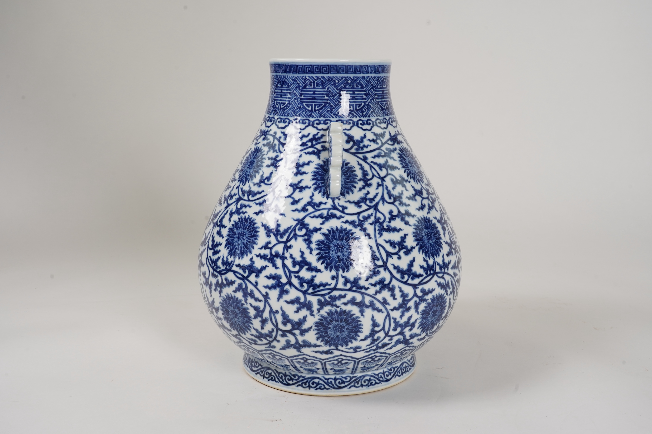 A large Chinese blue and white pear shaped vase, hu, Qianlong seal mark but later